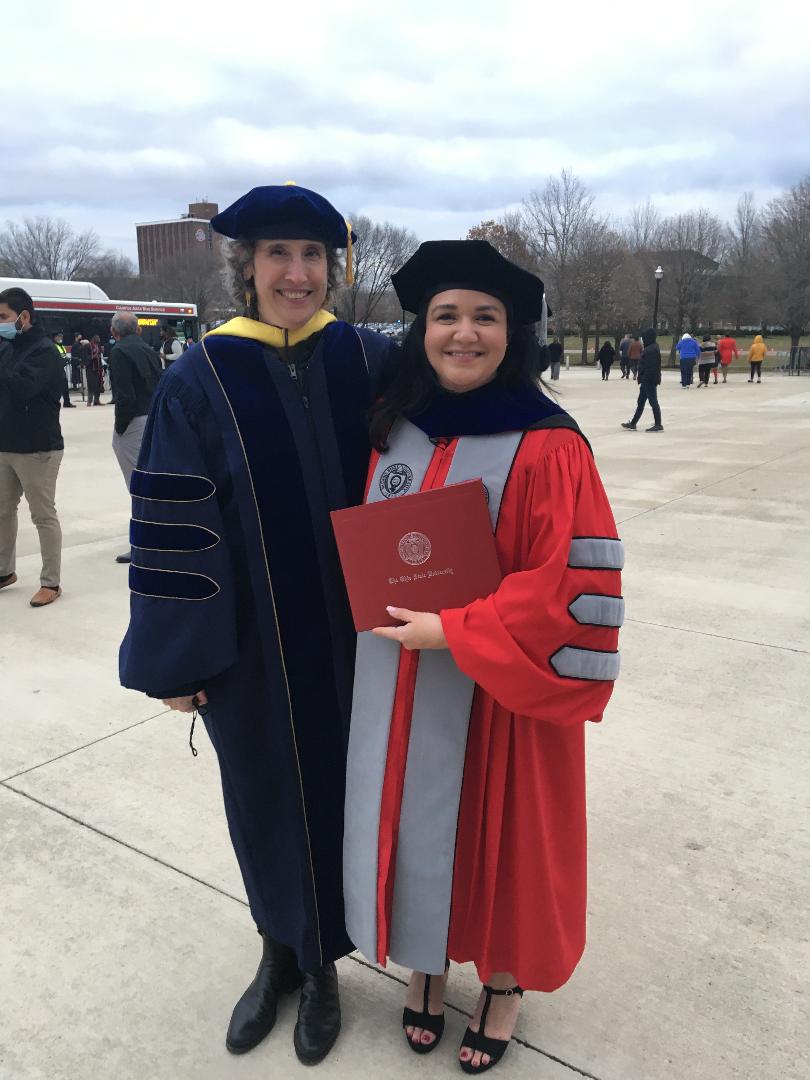 Anne-Marie Nunez and Jessica Rivera at graduation outdoors