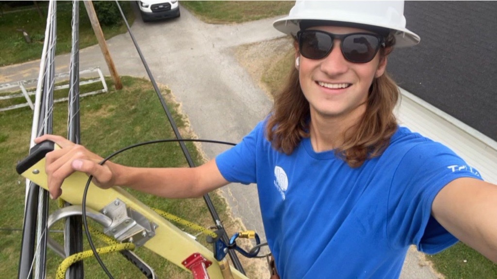 Ohio State student working on a cell phone tower