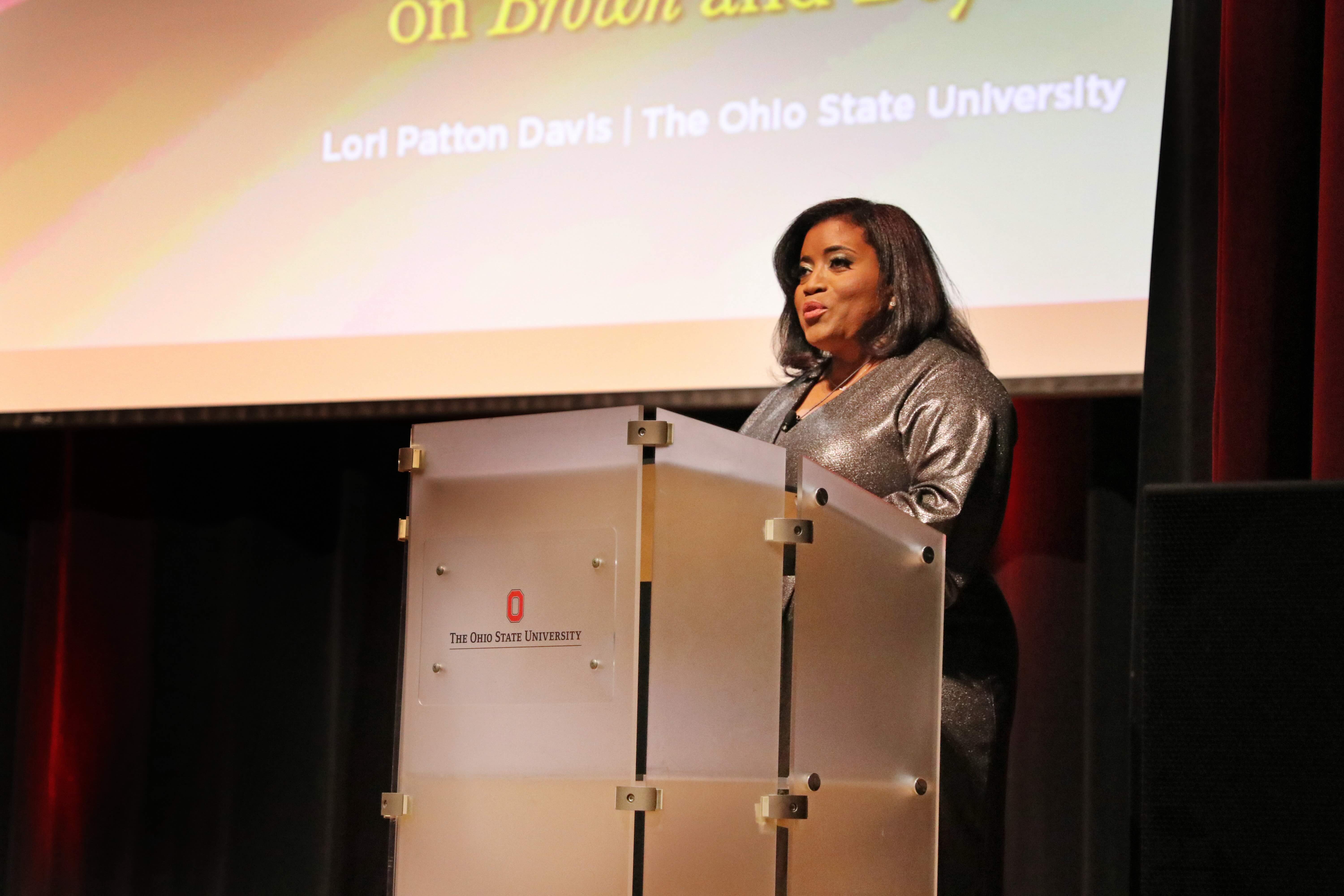 Lori Patton Davis on stage giving a speech for Ohio State