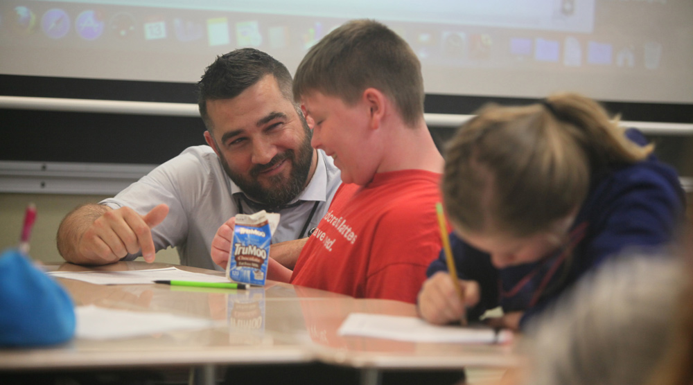 Teacher helping student