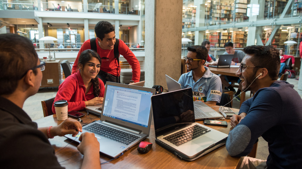 Students studying Thompson Library