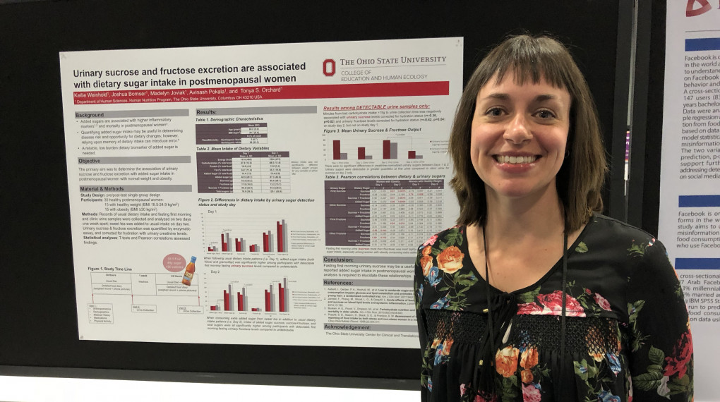 Grad student with research poster