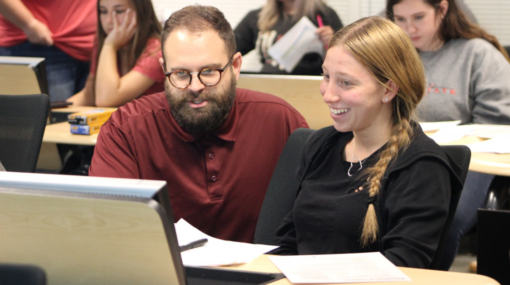 Instructor helping student