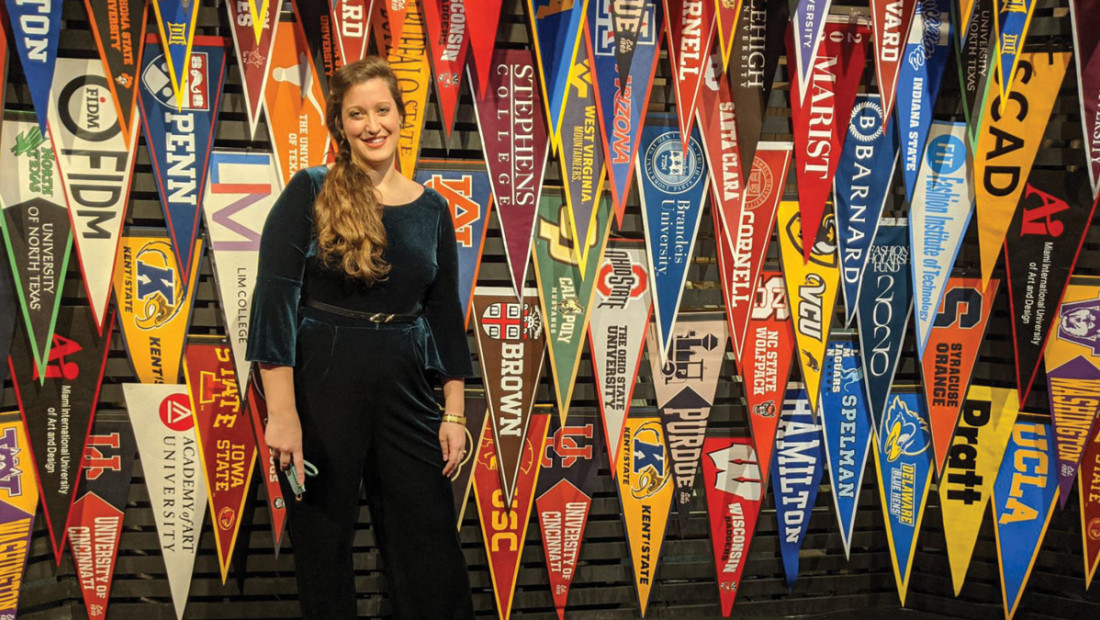 Alex Suer wth college pennants