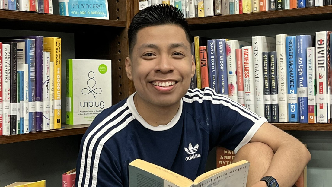 Ohio State EHE Alumni in a library reading a book