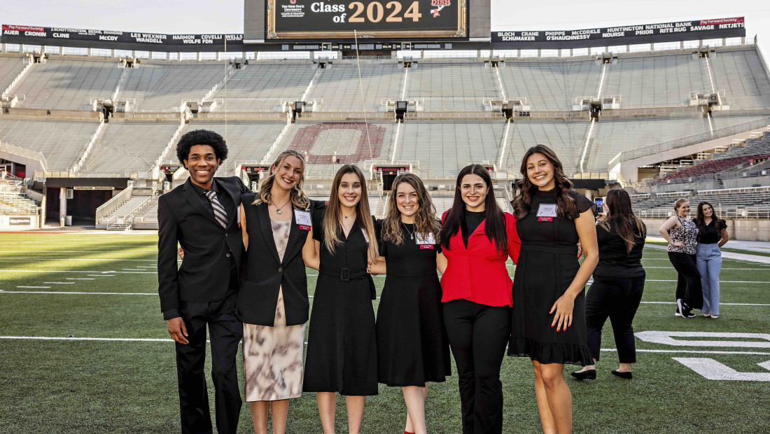 Ohio State students on the football field celebrating the Big Dish event