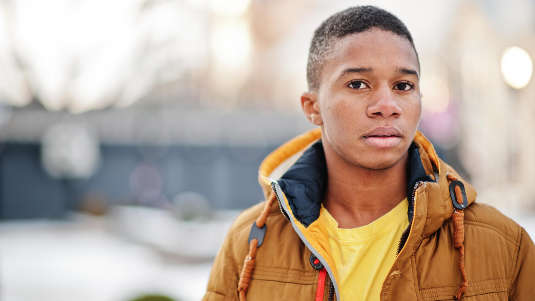 Young Black man in a winter coat