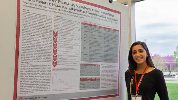 A research poster and grad student