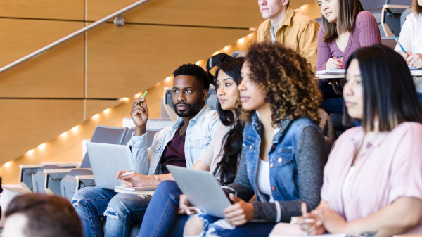 College students sitting in class in a lecture hall