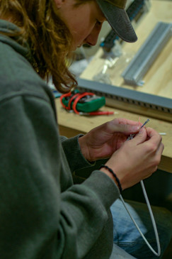 Man learning to splice 5G wires