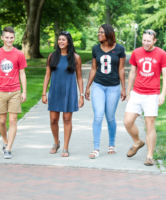 Friends walking on the oval