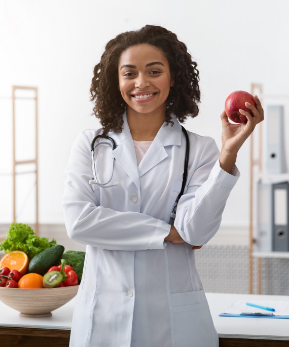 lady dietologist holding apple in her hand