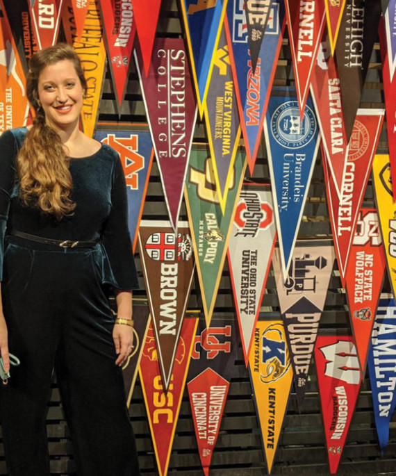 Alex Suer wth college pennants