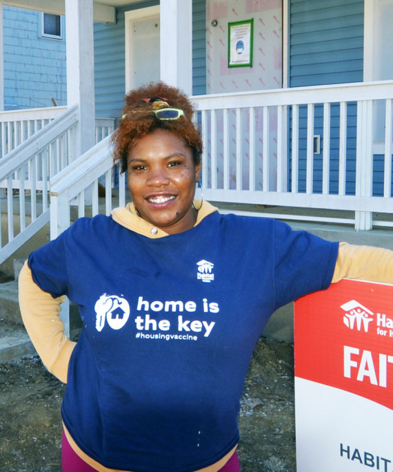 woman in front of house