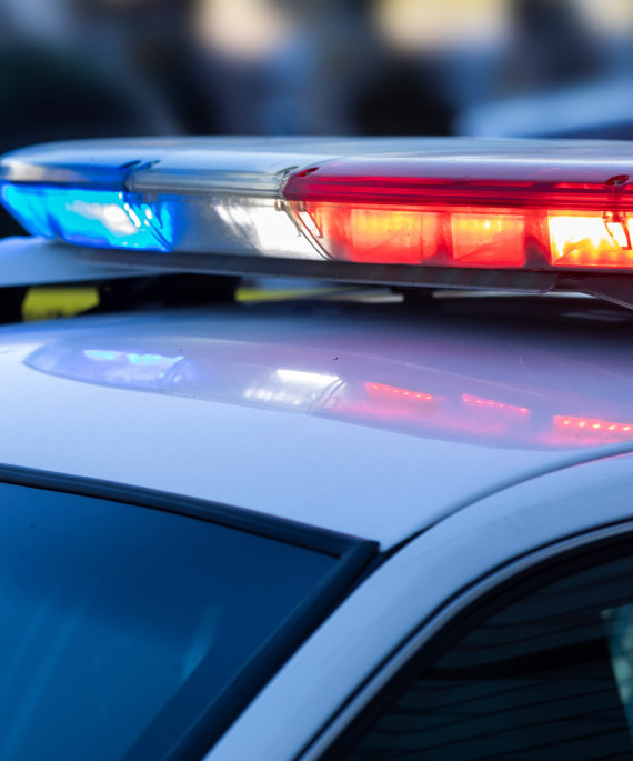 Police car with red and blue sirens on