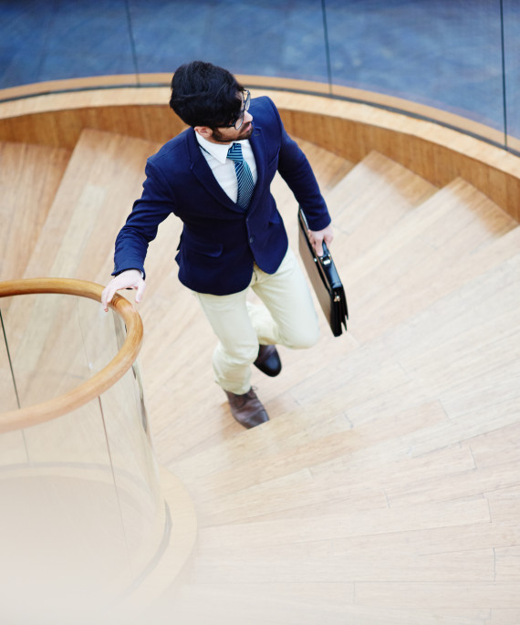 businessman climbing stairs