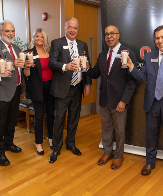 Group celebrating with milkshakes