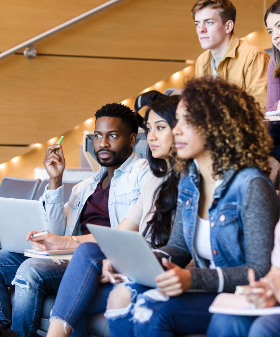 College students sitting in class in a lecture hall