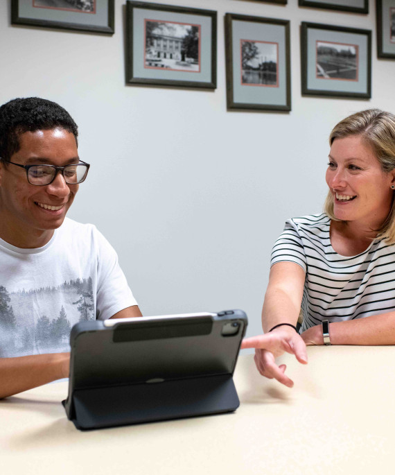 School counselor with Ohio State student meeting at a desk