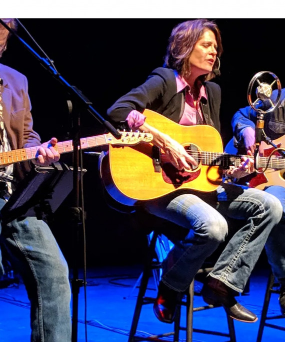 Anne DeChant and members of her band in concert