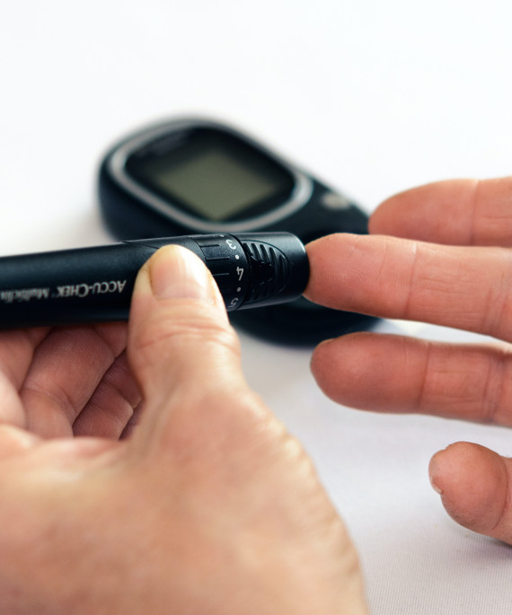 Person using finger prick to test blood sugar