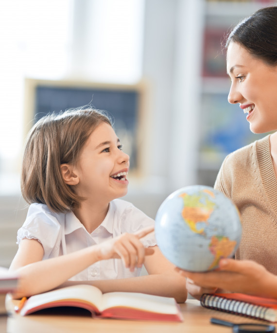 girl with teacher in classroom