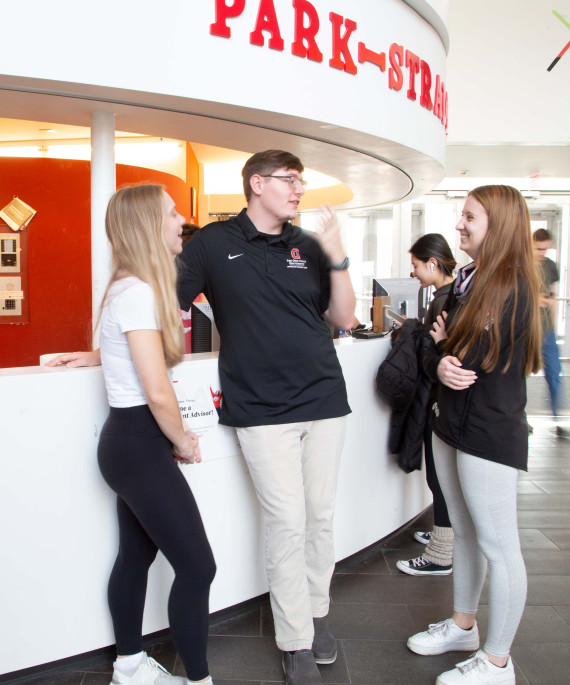 Ohio State SPA students talking at front desk