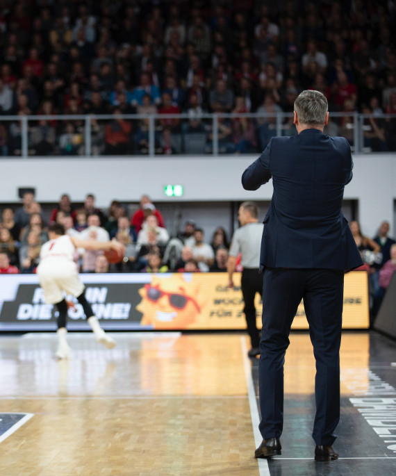 coach and players on basketball court