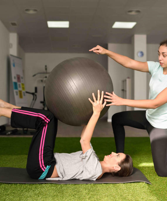 physical therapist assisting client