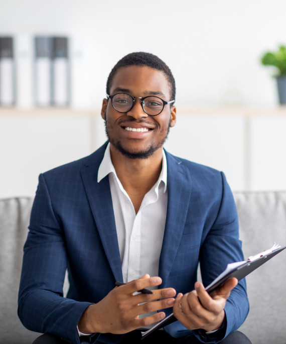 portrait-of-happy-black-male-psychologist-looking