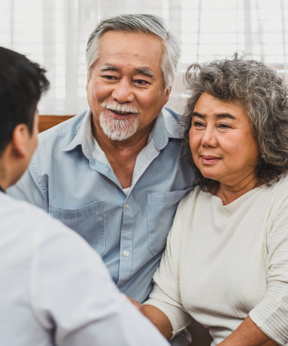 Couple talking to doctor