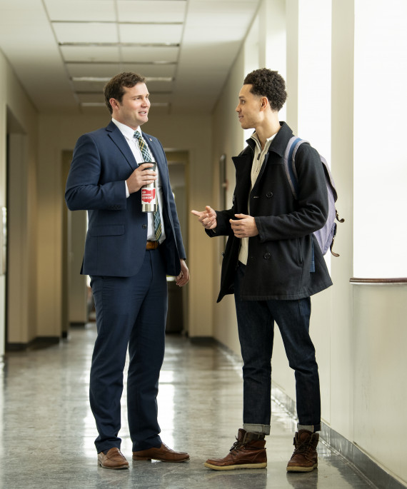 faculty talking in hallway