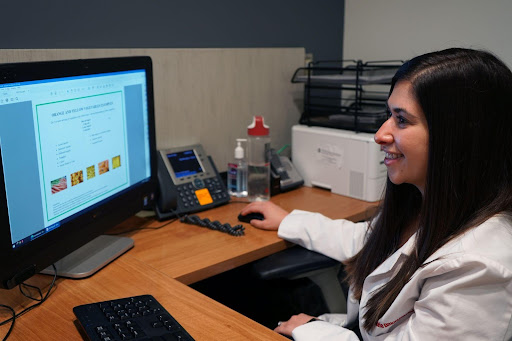 Anna Maria Bittoni works at her desk as a registered dietitian