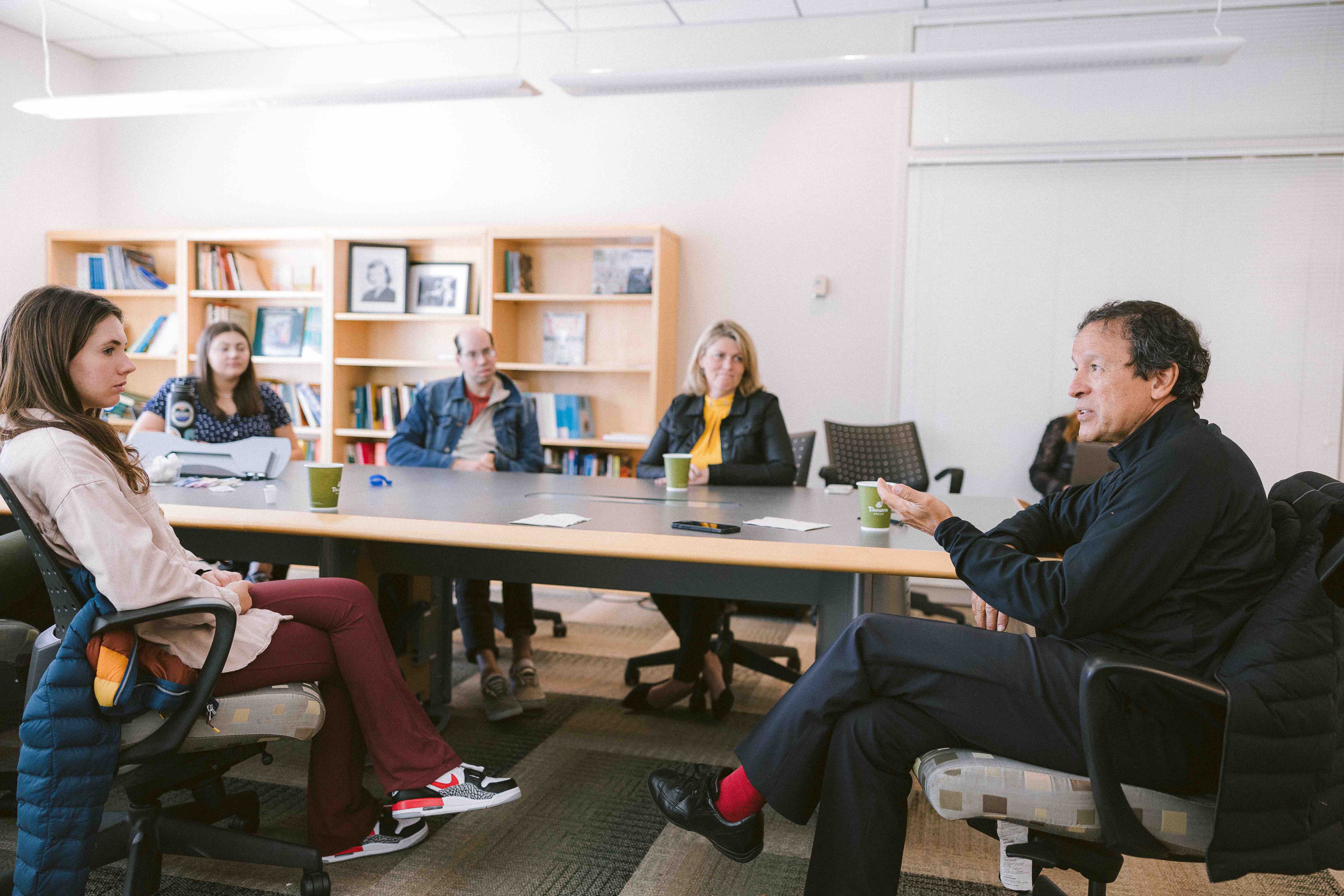 Frank Vizcarra with a group of Ohio State students talking at a table